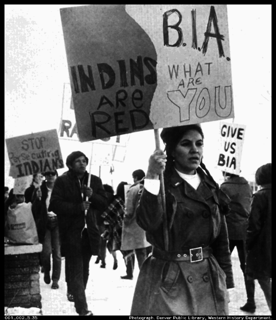 Protesters Against the Bureau of Indian Affairs holding signs 
