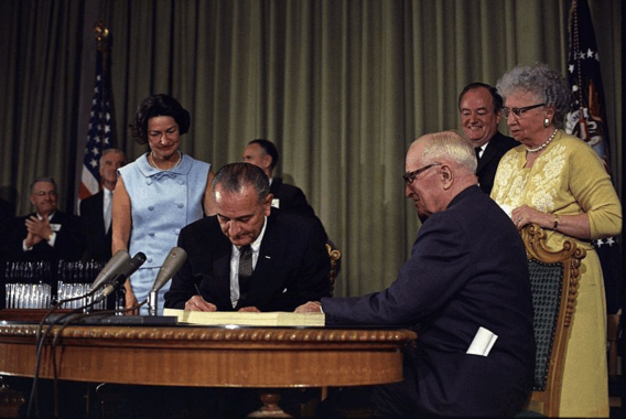 President Lyndon B. Johnson signing the Medicare Bill at the Harry S. Truman Library