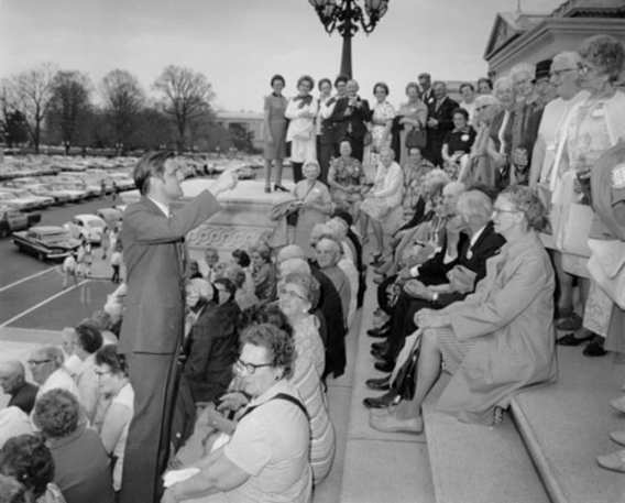 Senator Walter Mondale speaking to New Ulm, Minnesota's Golden Age Club on the steps of the U.S. Capitol in 1970;