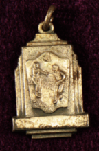 Front of 880 Yard Relay medal showing runner handing off baton